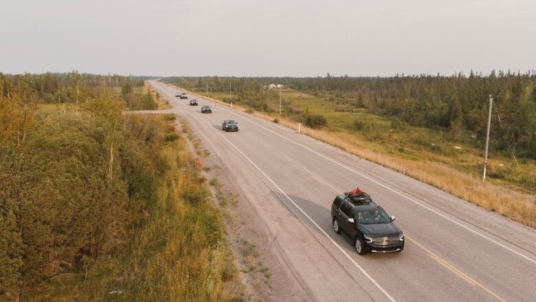 Yellowknife residents are seen driving out of the city on Highway 3, following an evacuation order prompted by a wildfire burning west of the territorial capital.