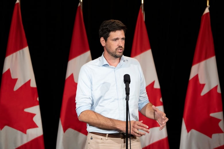 Sean Fraser, Minister of Housing, Infrastructure and Communities, speaks to reporters during the Liberal Cabinet retreat in Charlottetown, Monday, Aug. 21, 2023. 