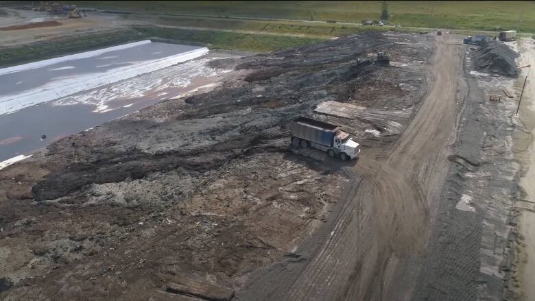 An aerial shot of a dump site. 