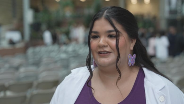 A woman is shown speaking.