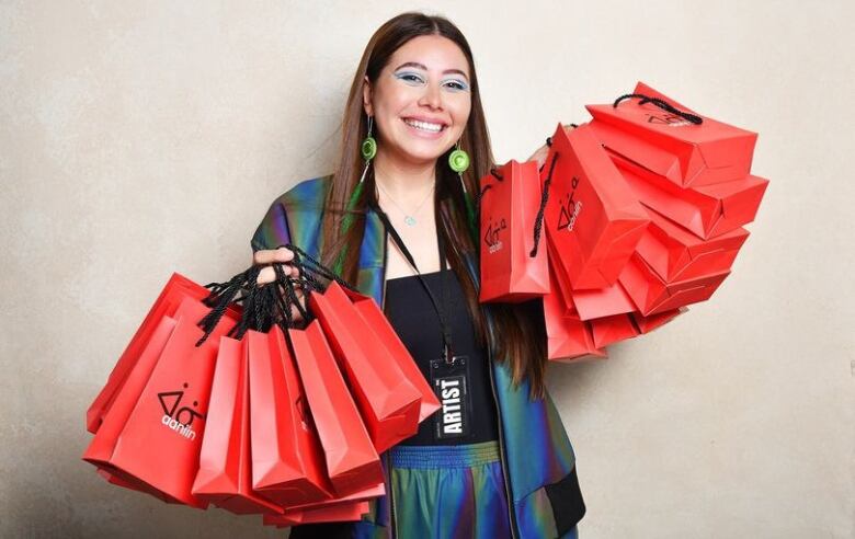 ChelseePettit posing with her store bags. 