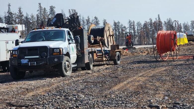 A truck with communications lines is pictured