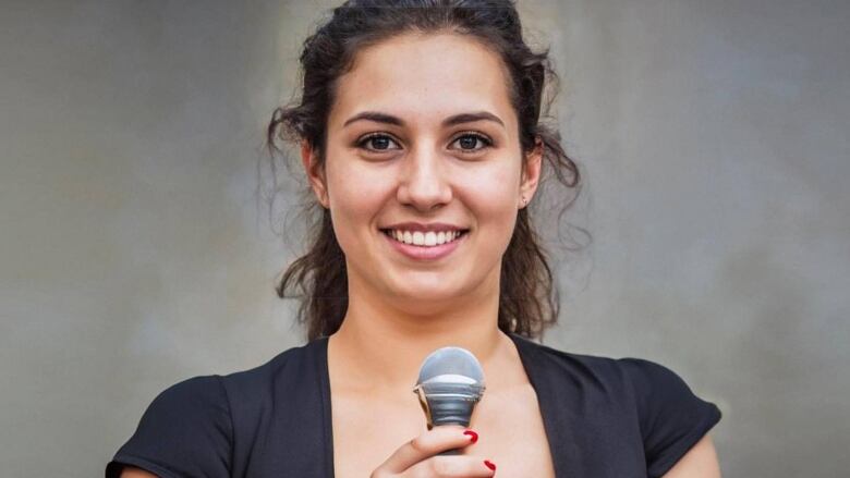 An AI-generated young woman holding a microphone. 