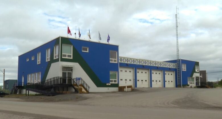 A large municipal building is seen from the outside.