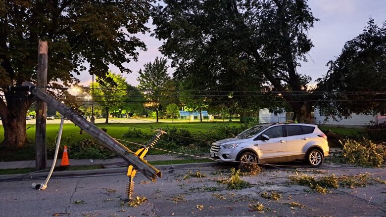 A hydro pull is shown snapped in half and laying on a street in Windsor. 