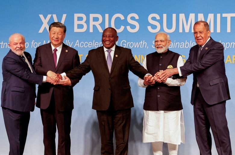 FILE PHOTO: President of Brazil Luiz Inacio Lula da Silva, President of China Xi Jinping, South African President Cyril Ramaphosa, Prime Minister of India Narendra Modi and Russia's Foreign Minister Sergei Lavrov pose for a BRICS family photo during the 2023 BRICS Summit at the Sandton Convention Centre in Johannesburg, South Africa, on August 23, 2023.  GIANLUIGI GUERCIA/Pool via REUTERS/File Photo