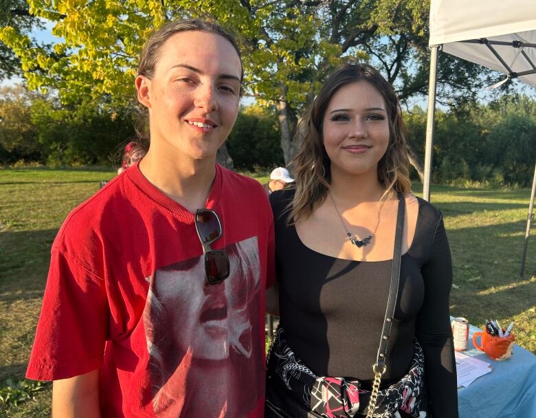 A man and a woman pose for a photo.