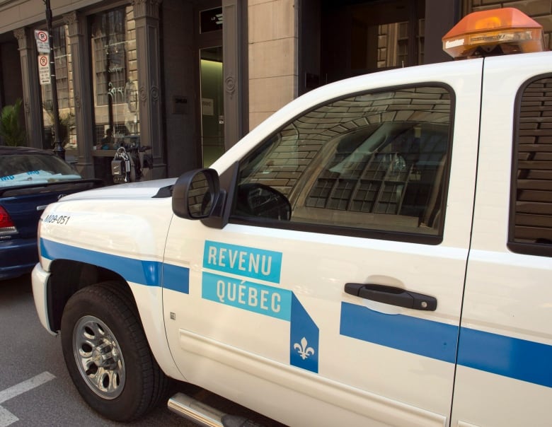 A Revenu Quebec car stationed on a Montreal street. 