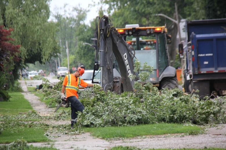 Tree branches are cleaned up in Essex County after a summer 2023 storm ripped through the region.