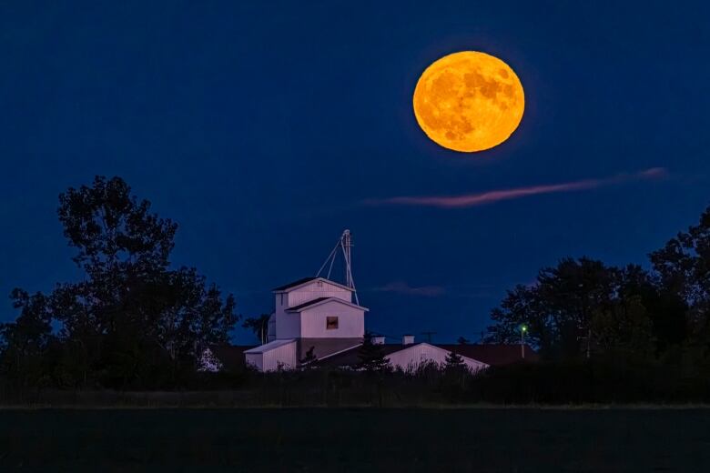 A full super blue moon is photographed from Windsor-Essex, Ont., Aug. 30, 2023.