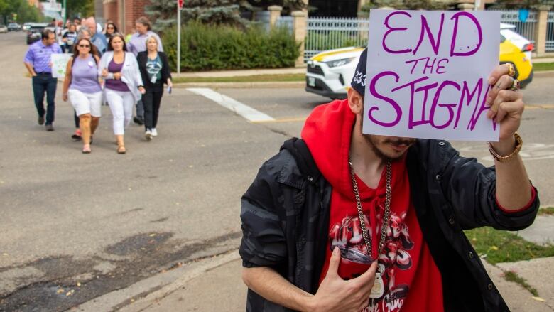 Brandon's Toxic Drug Poisoning Awareness Walk hosted by Manitoba Harm Reduction Network and Brandon Overdose Awareness marches down Ninth Street on Thursday, Aug. 31, 2023.