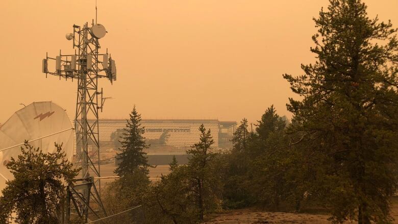 A hazy day with construction equipment behind.