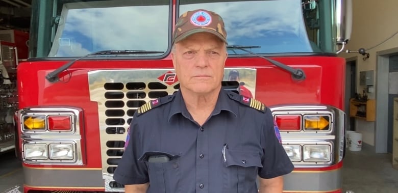 Man standing infront of a fire truck