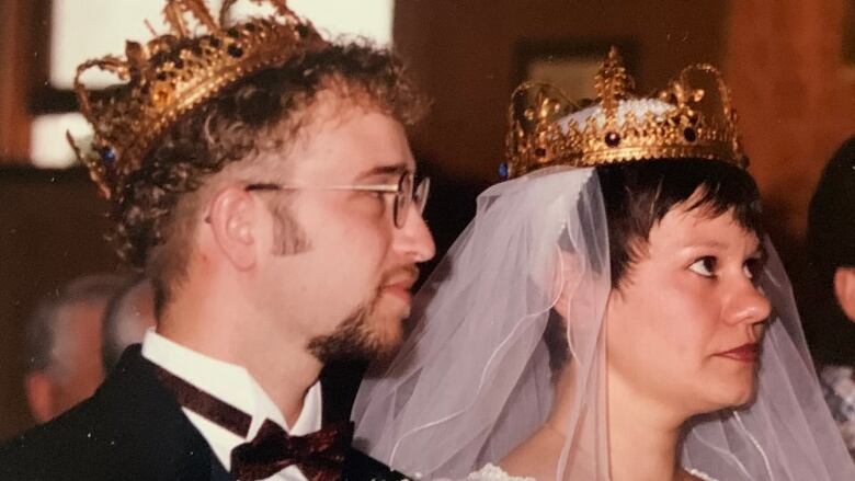 Two newly weds exchange vows during their wedding.