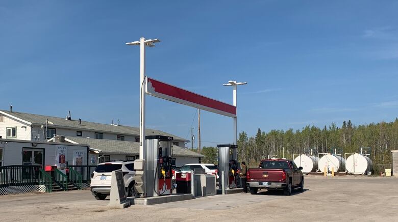 cars at a gas station 