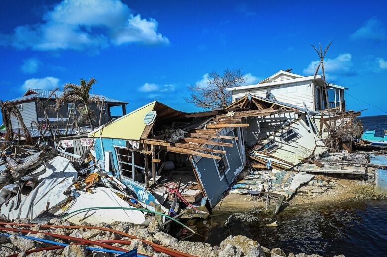 Houses lay damaged after a tropical hurricane.