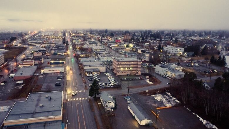 Drone shot of the city with fog