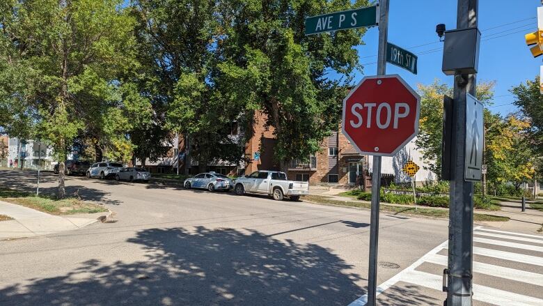 A stop sign and street sign that reads avenue P in Saskatoon