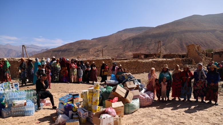 Women wait for donations, in the aftermath of a deadly earthquake, in the village of Ighil Ntalghoumt, Morocco, September 11, 2023.