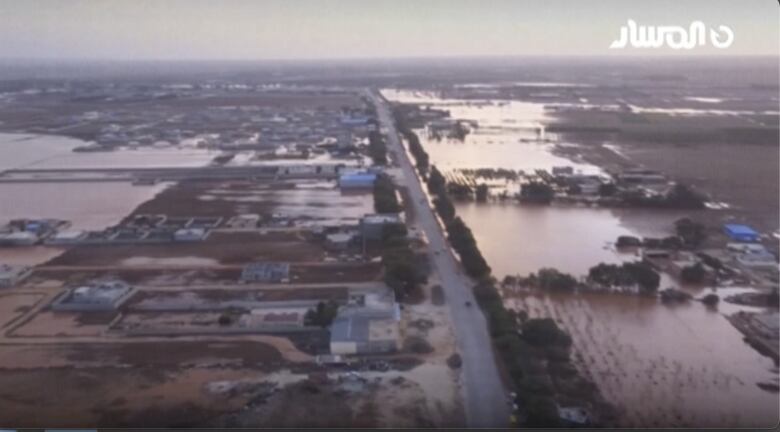 An aerial view shows a large section of land that is flooded with water.