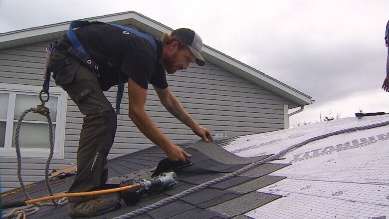 Man fixing roof