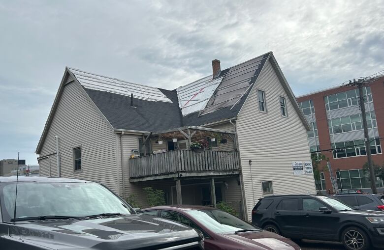 Roof covered with tarp