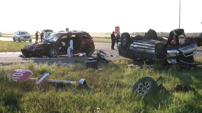 Two cars destroyed in a crash at an intersection of the highway