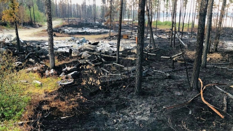 The charred remains of several cabins lost to wildfires in northern, Que. 