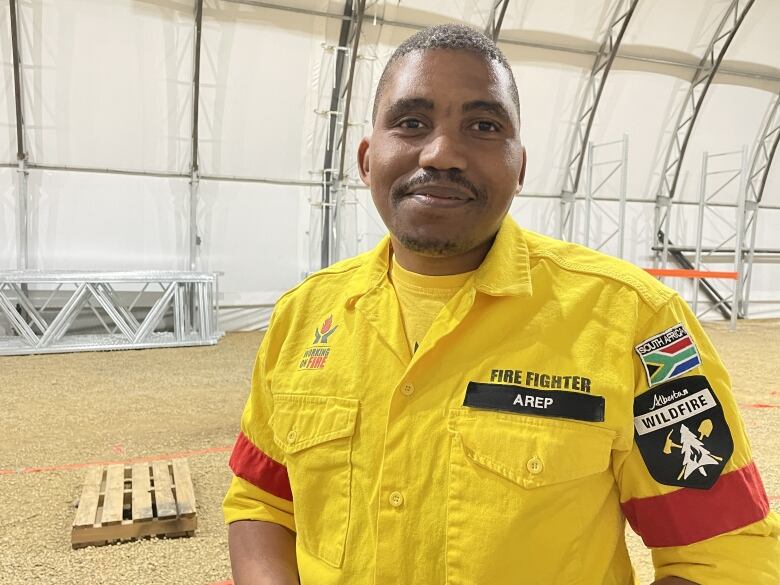 Khulani Zulu a South African man is pictured wearing a yellow jacket. 