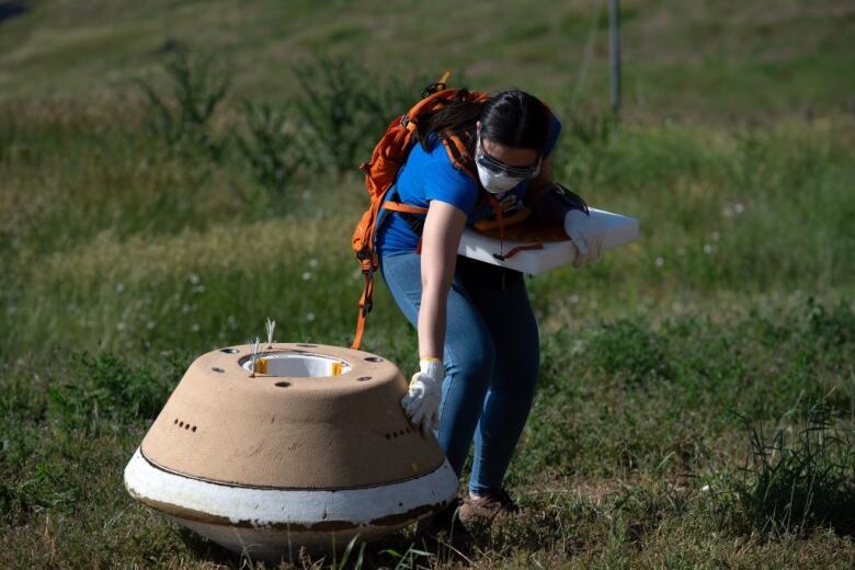 A replica of a space capsule sent to collect material from an asteroid. 