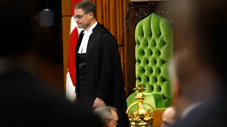 The Speaker stands in the House of Commons.