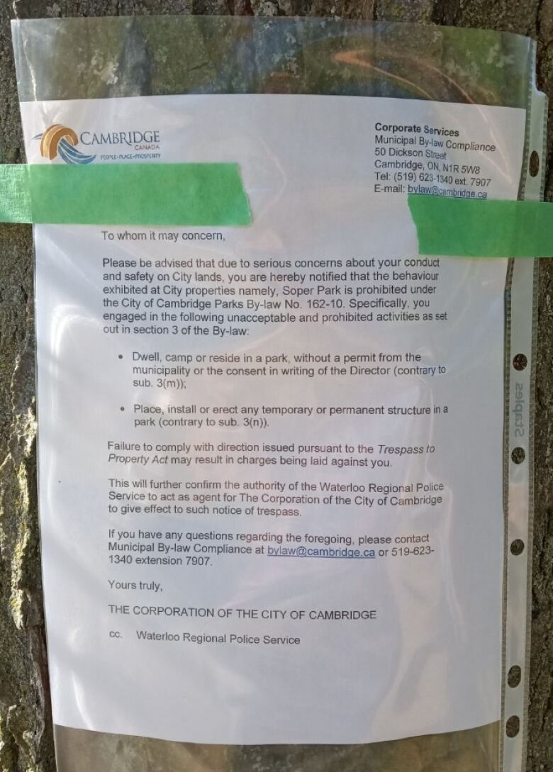 Image of the notice posted by the city on a tree in Soper Park. 