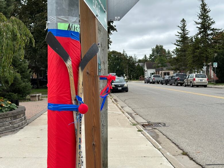 A common display of pride was hockey sticks and colours fixed to hydro poles.