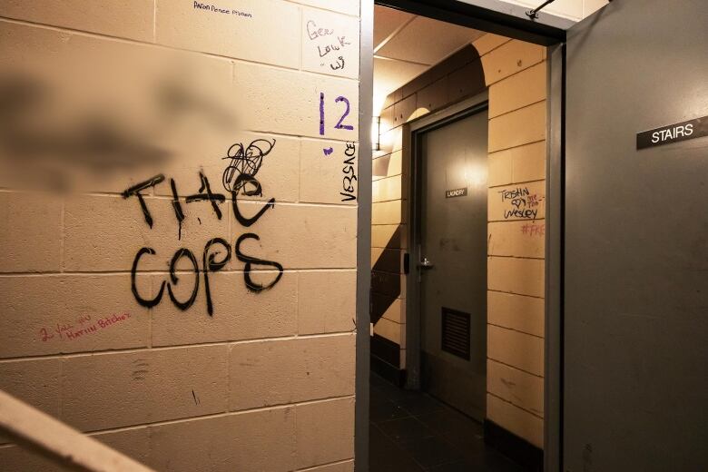 Graffiti can be seen throughout the hallways and stairwells of the Manitoba Housing building at 444 Kennedy St. 