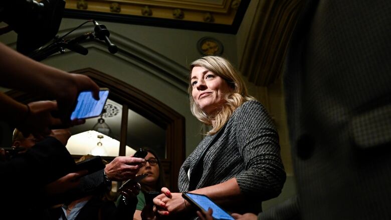 Minister of Foreign Affairs Melanie Joly speaks to reporters as she arrives for a meeting of the federal cabinet on Parliament Hill in Ottawa, on Tuesday, Oct. 3, 2023.