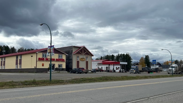 The main street of Watson Lake, with flags and buildings visible. 