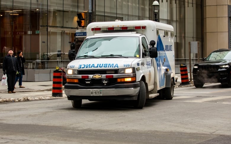 An Ambulance turning east onto Adelaide Street from Yonge Street on March 3, 2023.