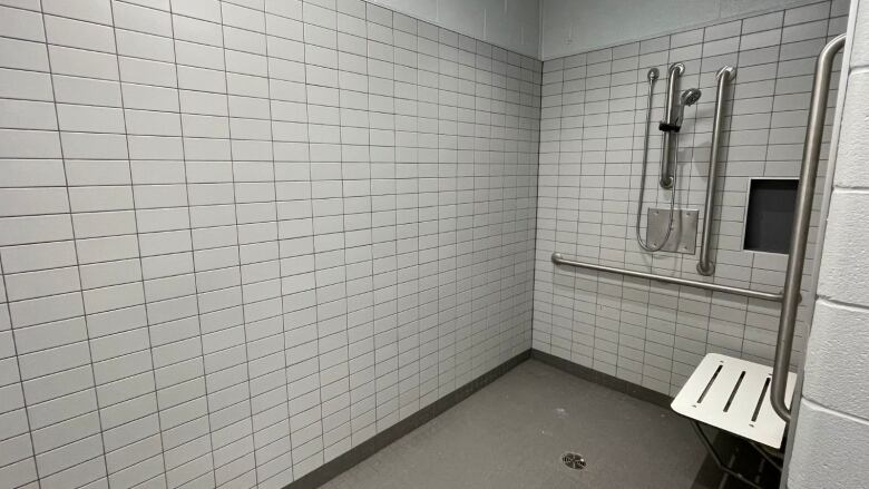 A shower inside a dressing room.