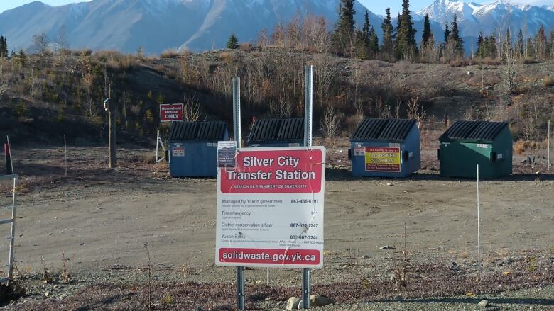 A row of garbage dumpsters