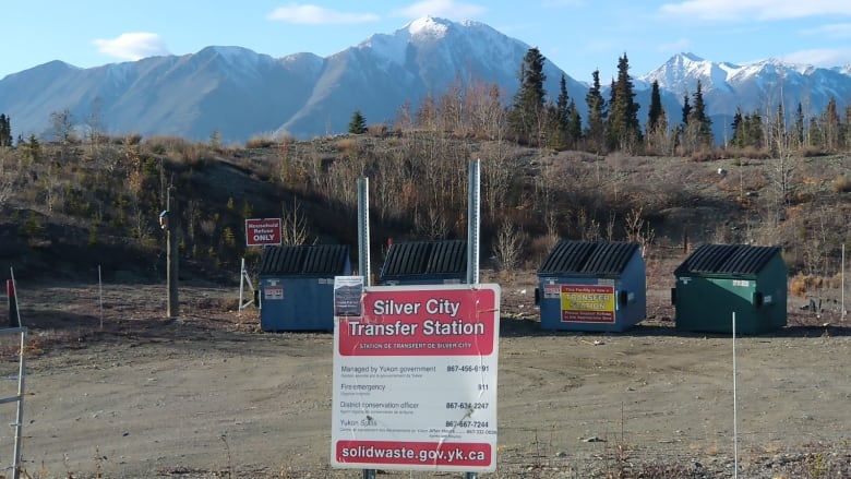 A row of garbage dumpsters