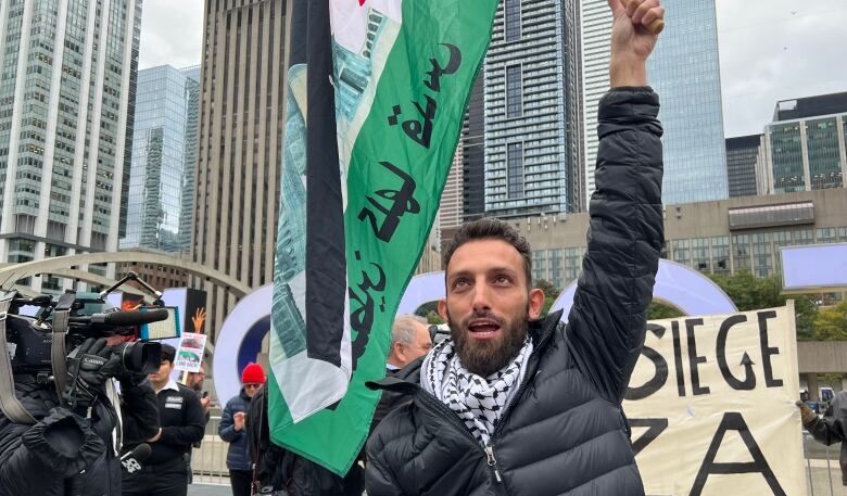 The rally in Toronto was a peaceful affair. Supporters held Palestinian flagschanting 'free Palestine' as they marched along Queen Street