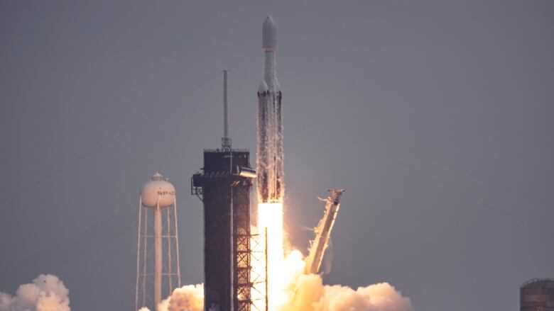 A rocket is seen lifting off.