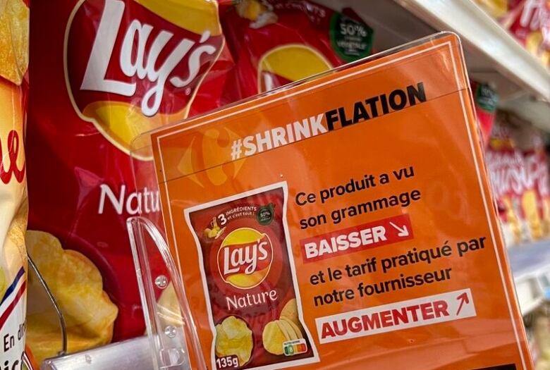 A sign in French at French supermarket chain Carrefour warning shoppers of products that have been downsized. 