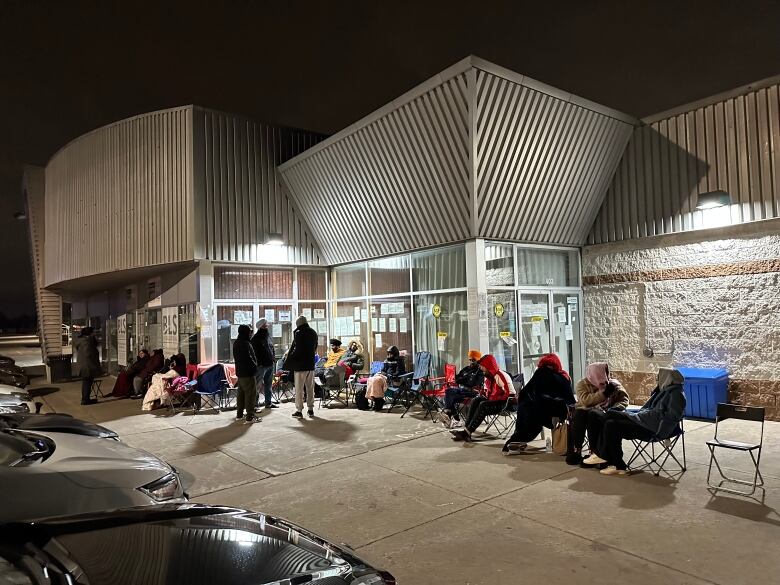 Line up outside BLS International for Overseas Citizens of India card at midnight. 