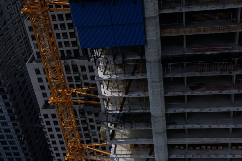 Partial view from high up of an unfinished luxury condo, with no exterior walls. It has been placed under receivership.