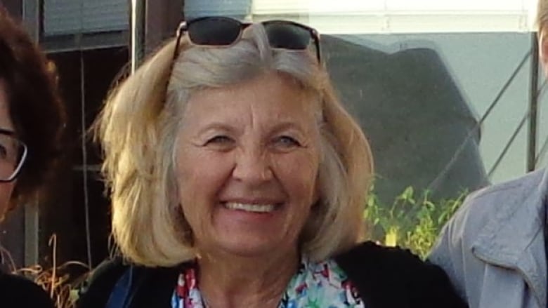 A headshot of a woman with blonde hair smiling for a photo.