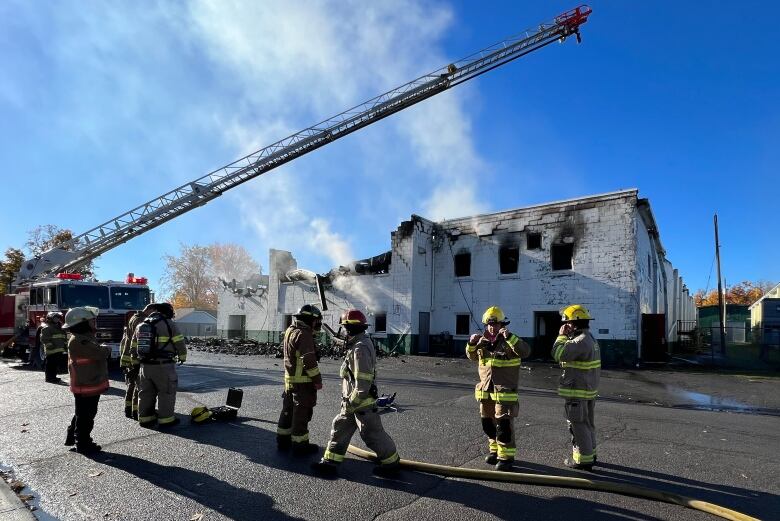 Firefighters were still working to extinguish the fire at mid-morning Monday.