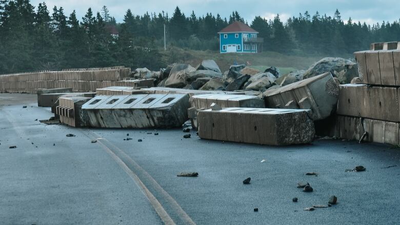 A seawall knocked down during Hurricane Lee on Shore Road in Liverpool, N.S. is shown in a handout photo.