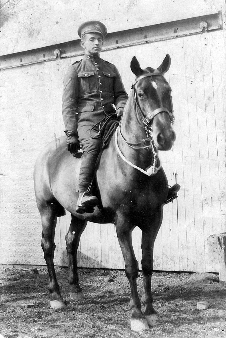 A postcard sent from soldier Oliver Dube on a horse. 