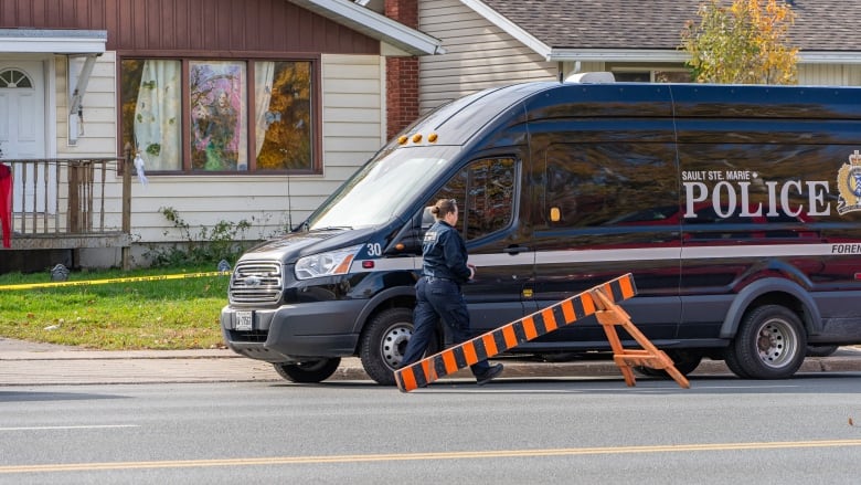 A police forensic unit attends a crime scene on Second Line, in Sault Ste. Marie, Ont., 